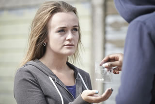 Teen buying drugs